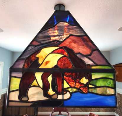 bear stained glass lampshade lit